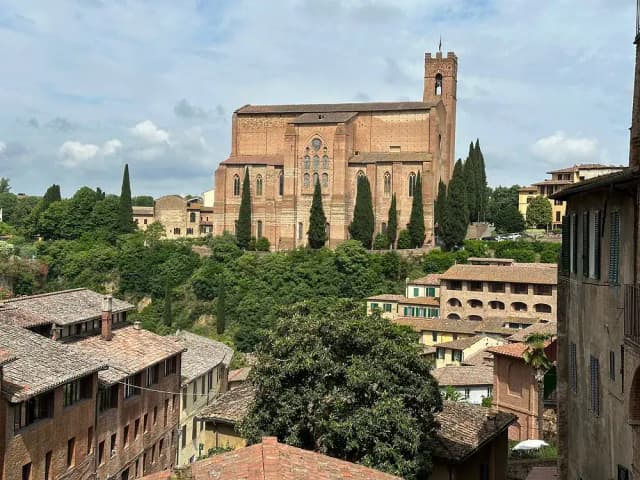 The Basilica of San Domenico seen over the rooftops of Siena