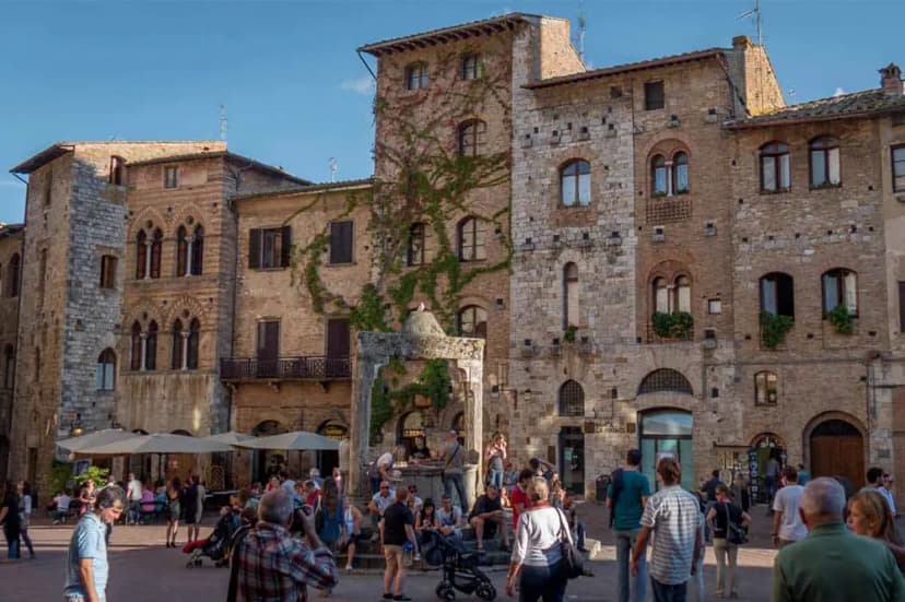 The main square of San Gimignano surrounded by medieval buildings